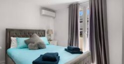 Elegant 2 bedroom apartment with private patio & Rooftop terrace.